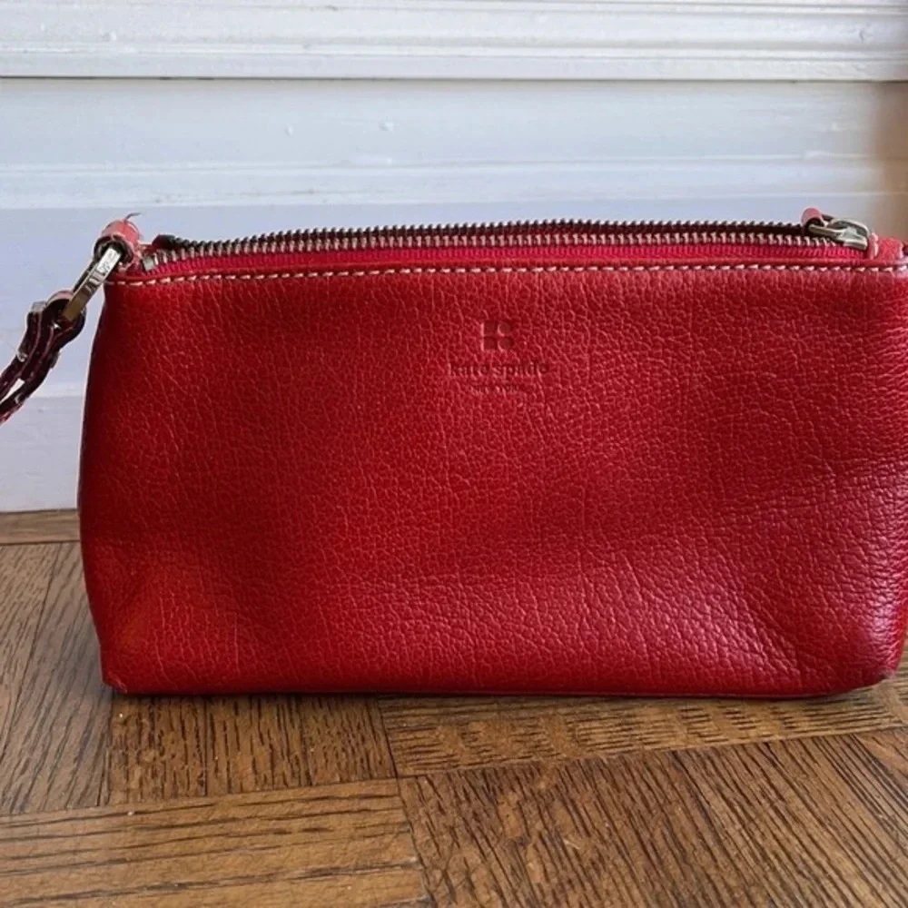 Kate Spade red pebbled leather wristlet bag